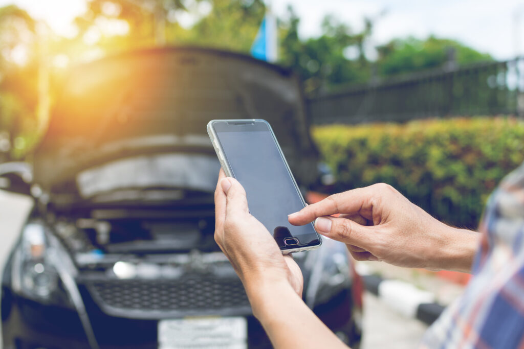 person on mobile phone looking for urgent cash loans for car repair