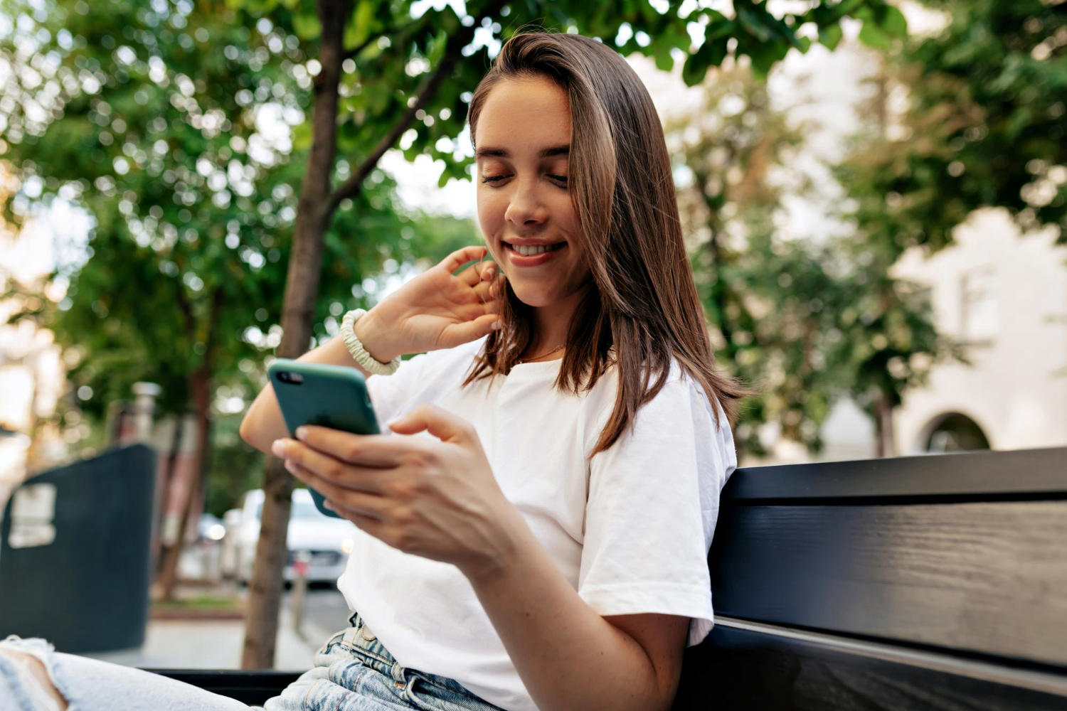 woman looking down at mobile screen to contact fasta loan