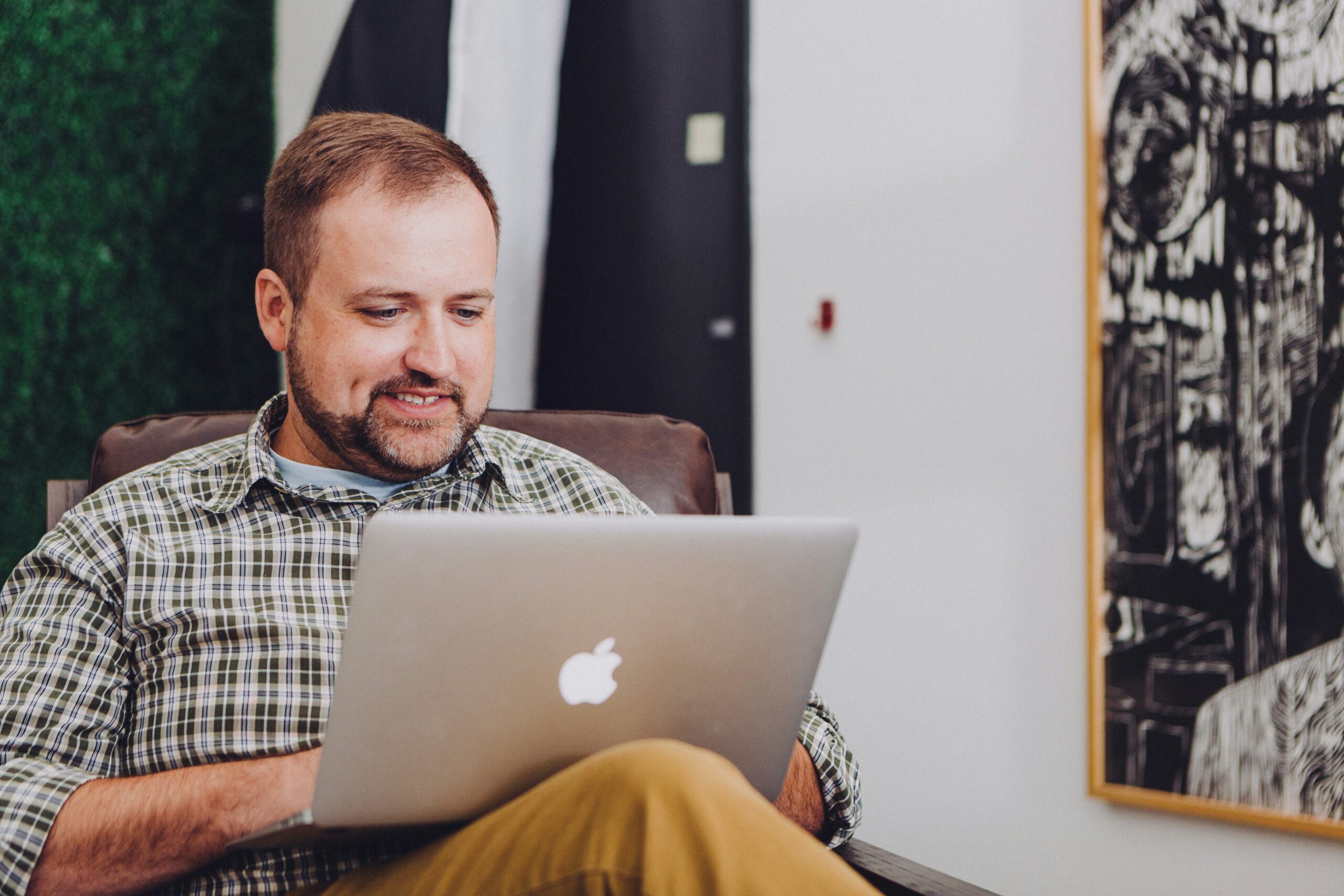 man on laptop looking for urgent cash loan
