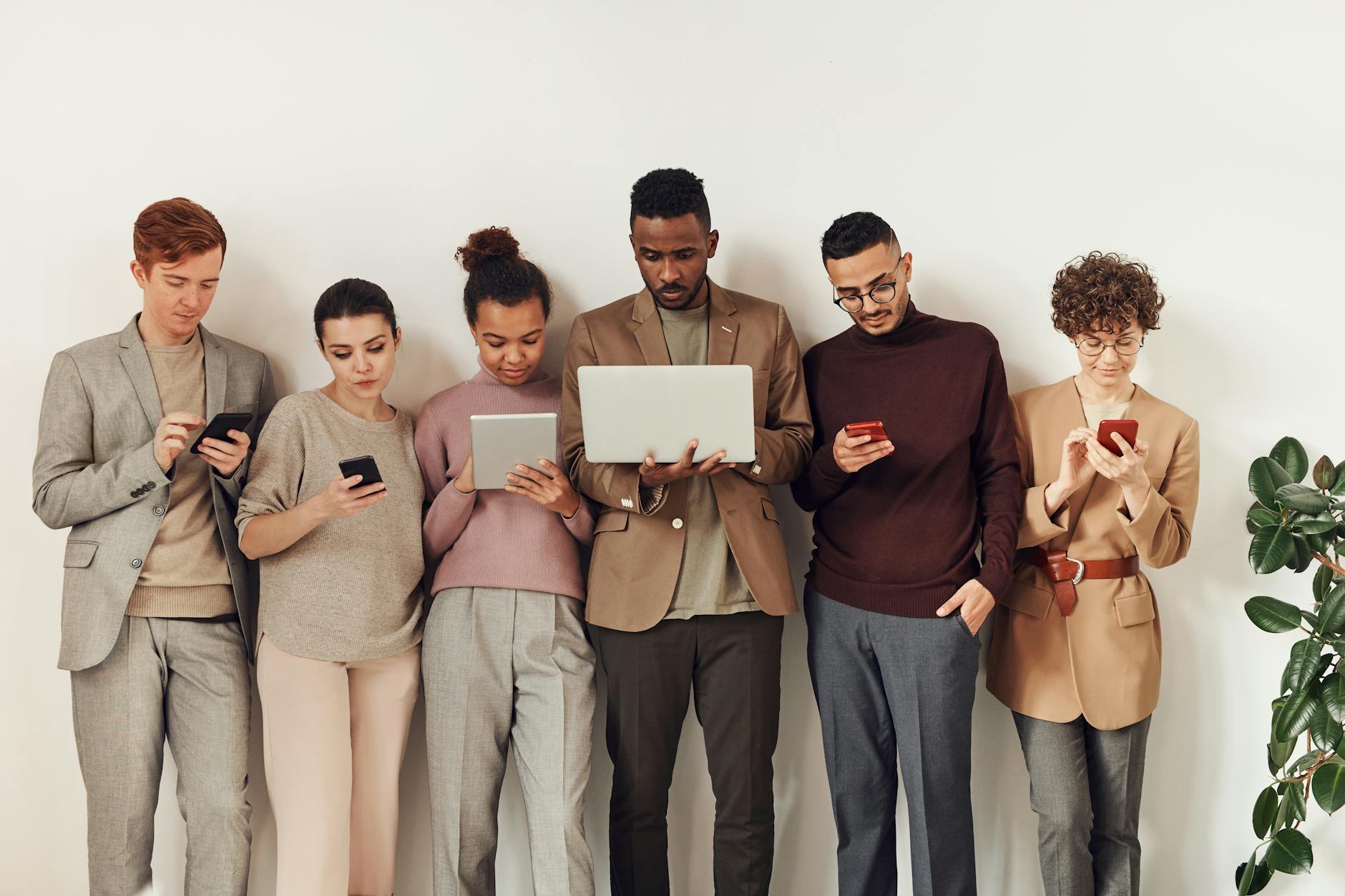 photo of people using gadgets to look at credit scores