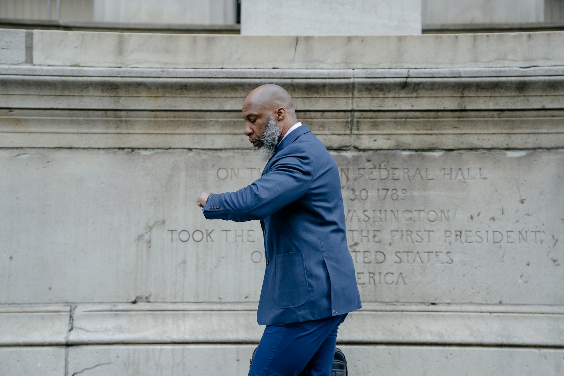 a man in a suit checking the time for quick loans