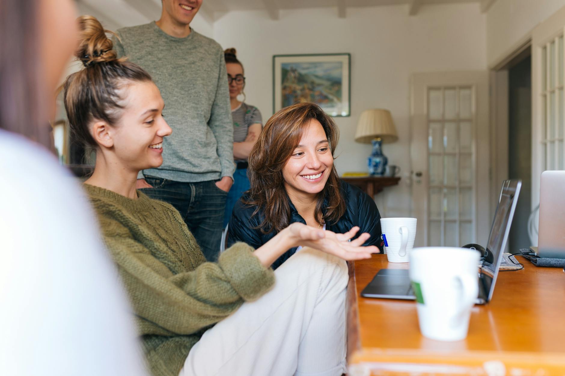 people looking at laptop for things to remember once approved for emergency loan