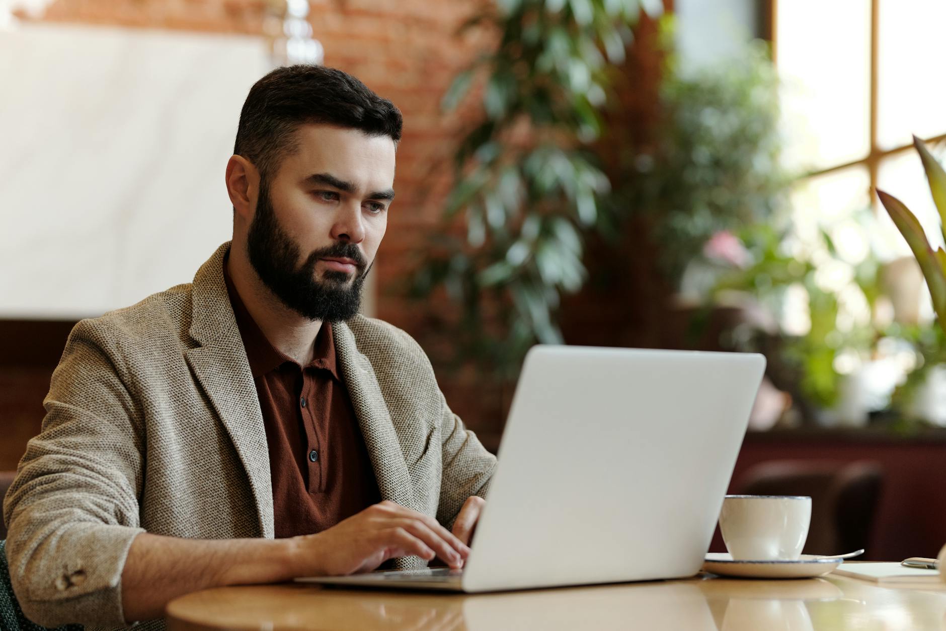 man using laptop in the restaurant for emergency loans